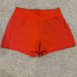 Athleta Bright Orange Athletic Shorts with Zipper Pocket